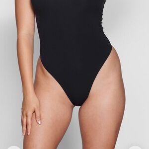 SKIMS Black One-Piece bodysuit